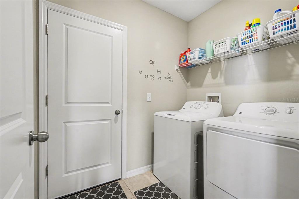 9424 Lemon Drop Loop Sun City Center, FL 33573 - Photo 17 of 31 a utility room with dryer and washer