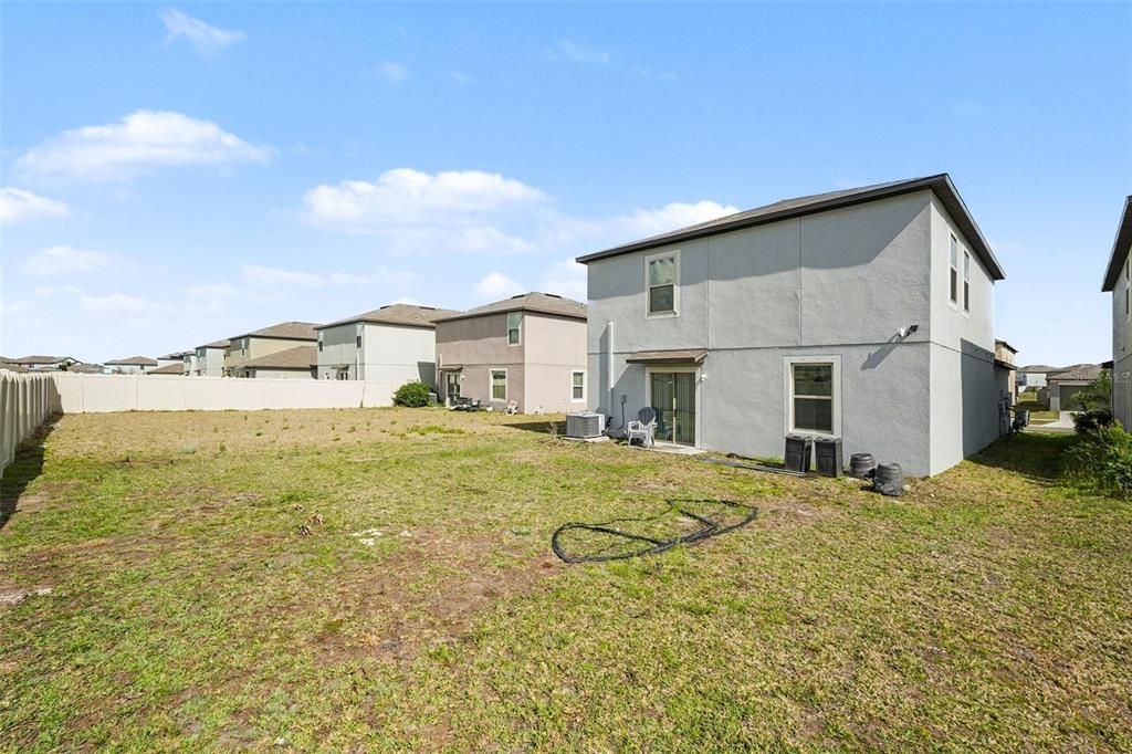 9424 Lemon Drop Loop Sun City Center, FL 33573 - Photo 31 of 31 a bathroom with a granite countertop sink and a shower