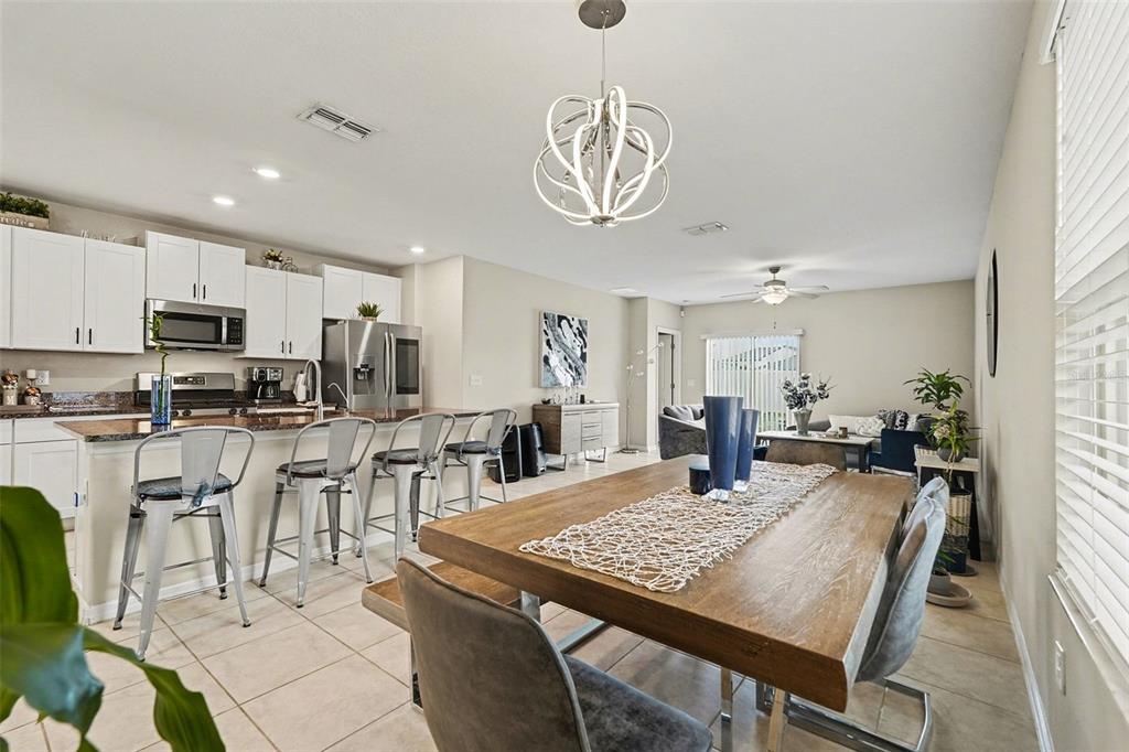 9424 Lemon Drop Loop Sun City Center, FL 33573 - Photo 8 of 31 a view of a dining room with furniture