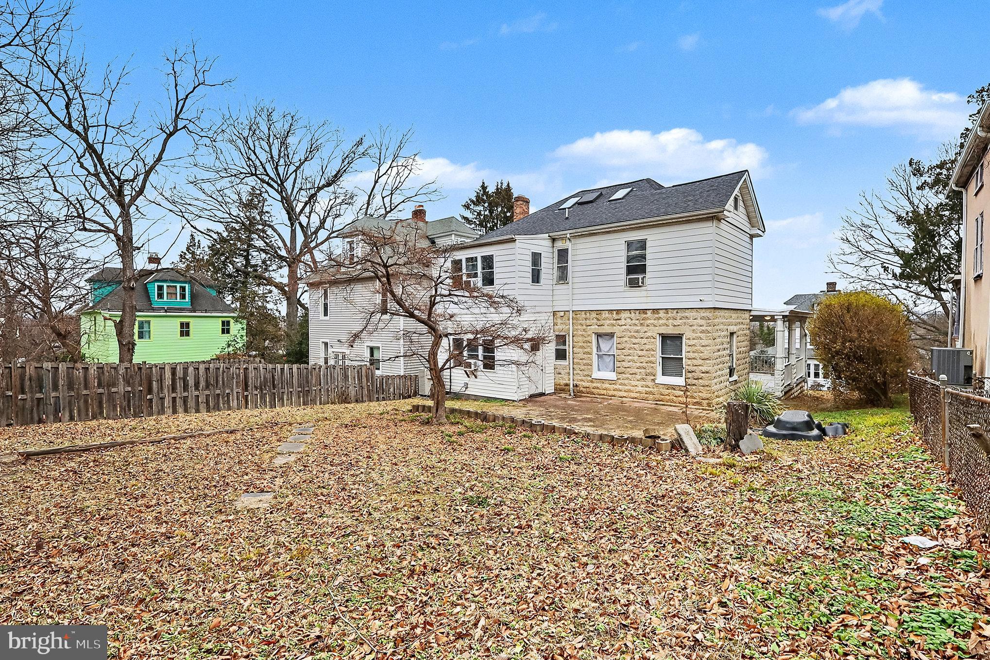 4014 33rd Street Mount Rainier, MD 20712 - Photo 30 of 37 a view of a house with a yard covered with snow in the background