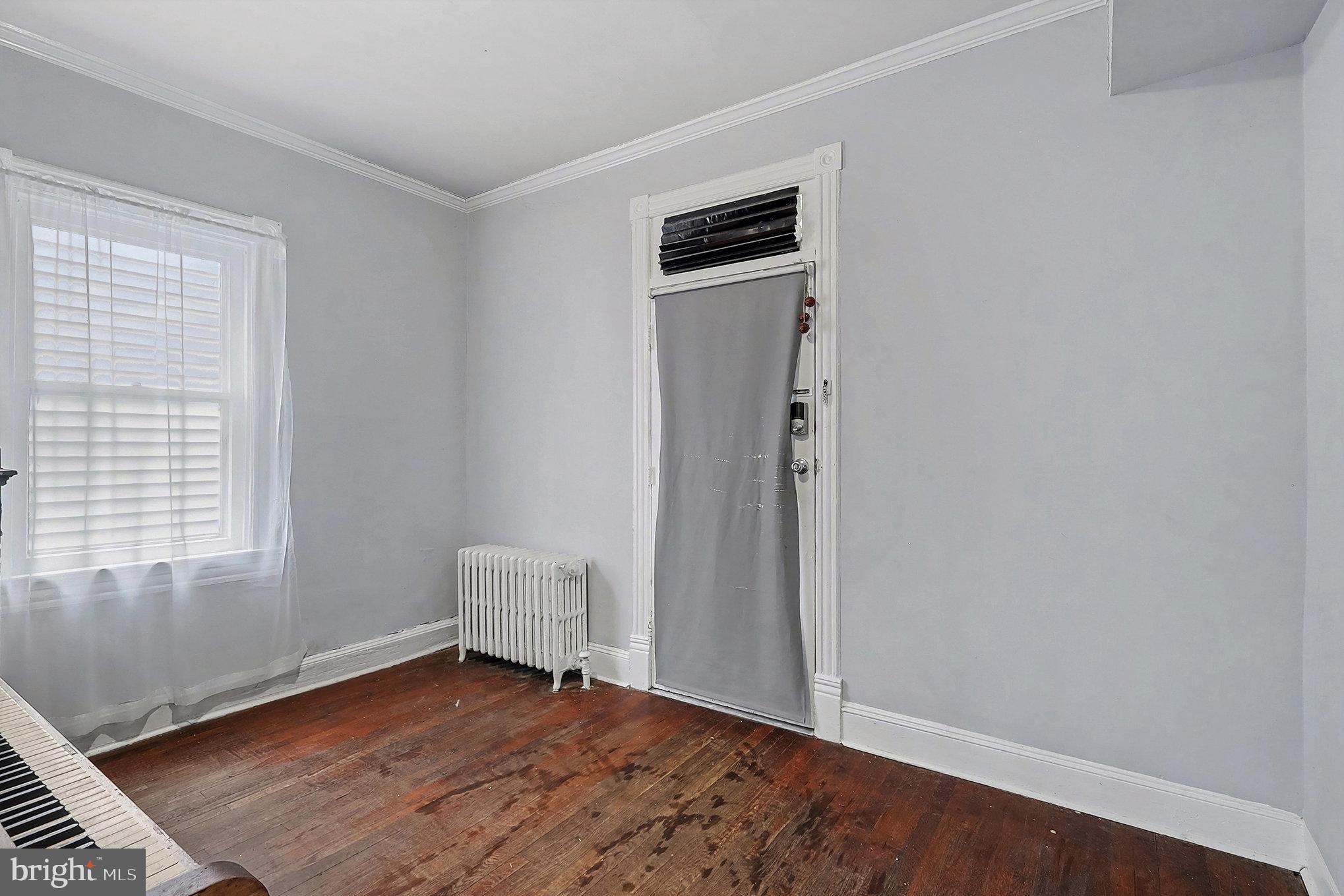 4014 33rd Street Mount Rainier, MD 20712 - Photo 7 of 37 an empty room with wooden floor and windows
