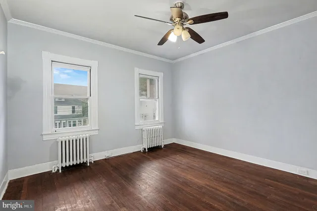 a bedroom with a bed and a chair