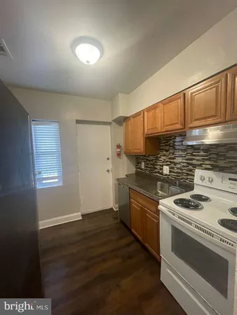a kitchen with a stove and a microwave