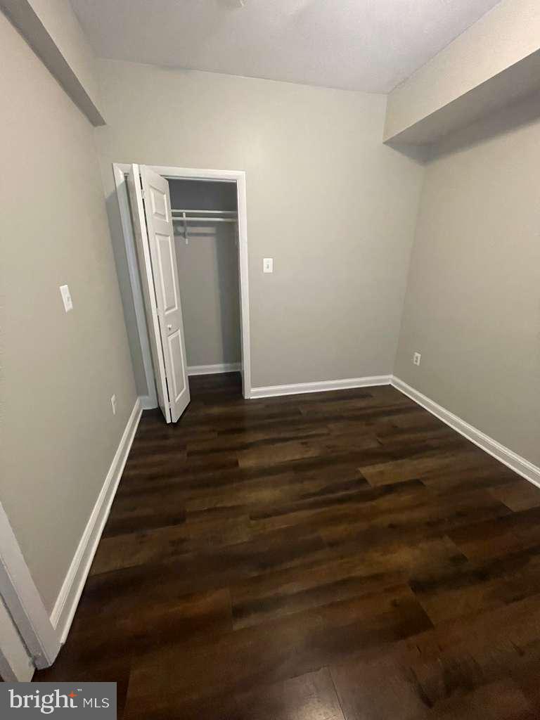 2830 R Street Southeast Washington, DC 20020 - Photo 10 of 14 wooden floor in an empty room