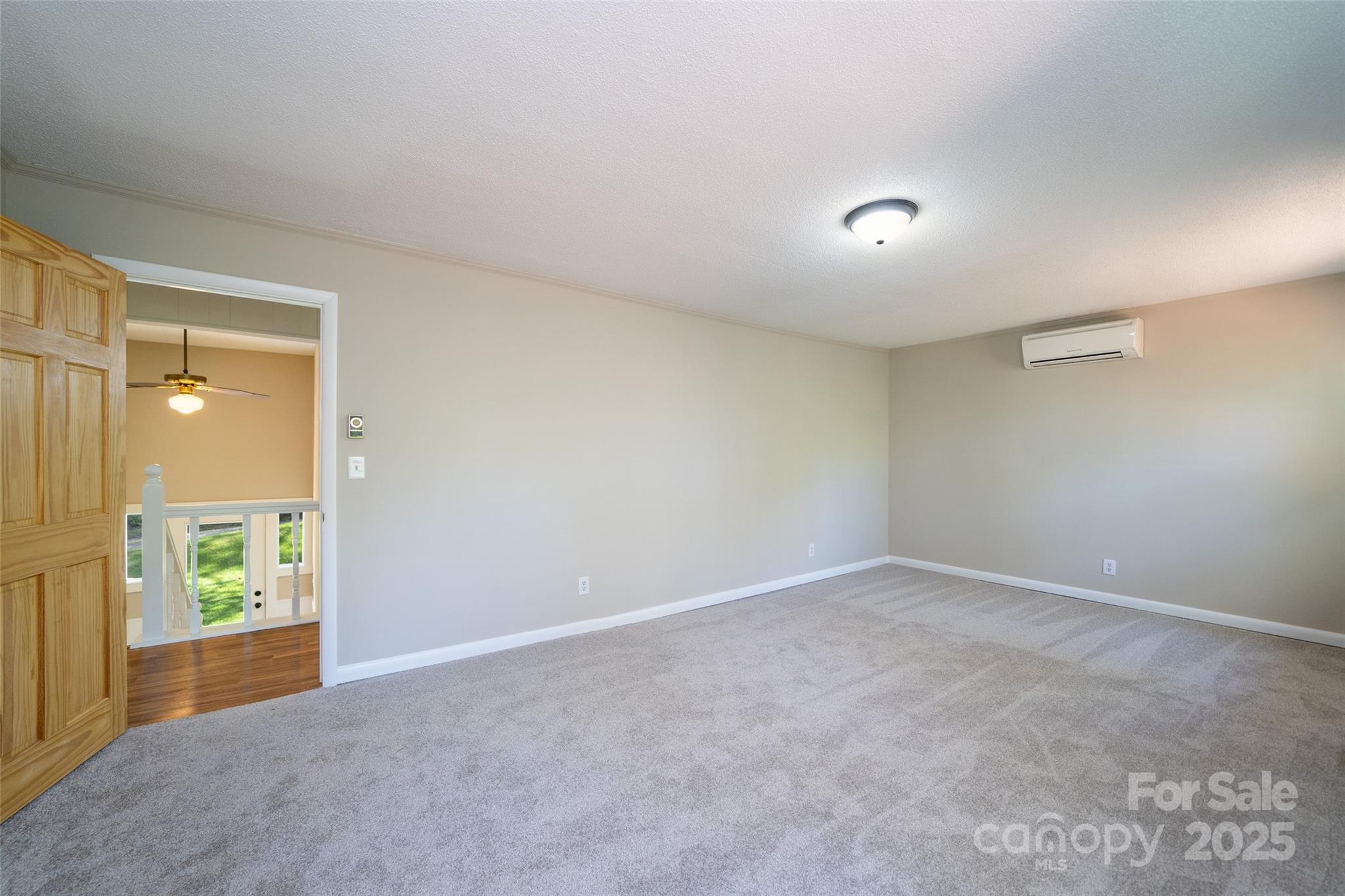 145 Jeter Mountain Road Hendersonville, NC 28739 - Photo 17 of 31 an empty room with windows