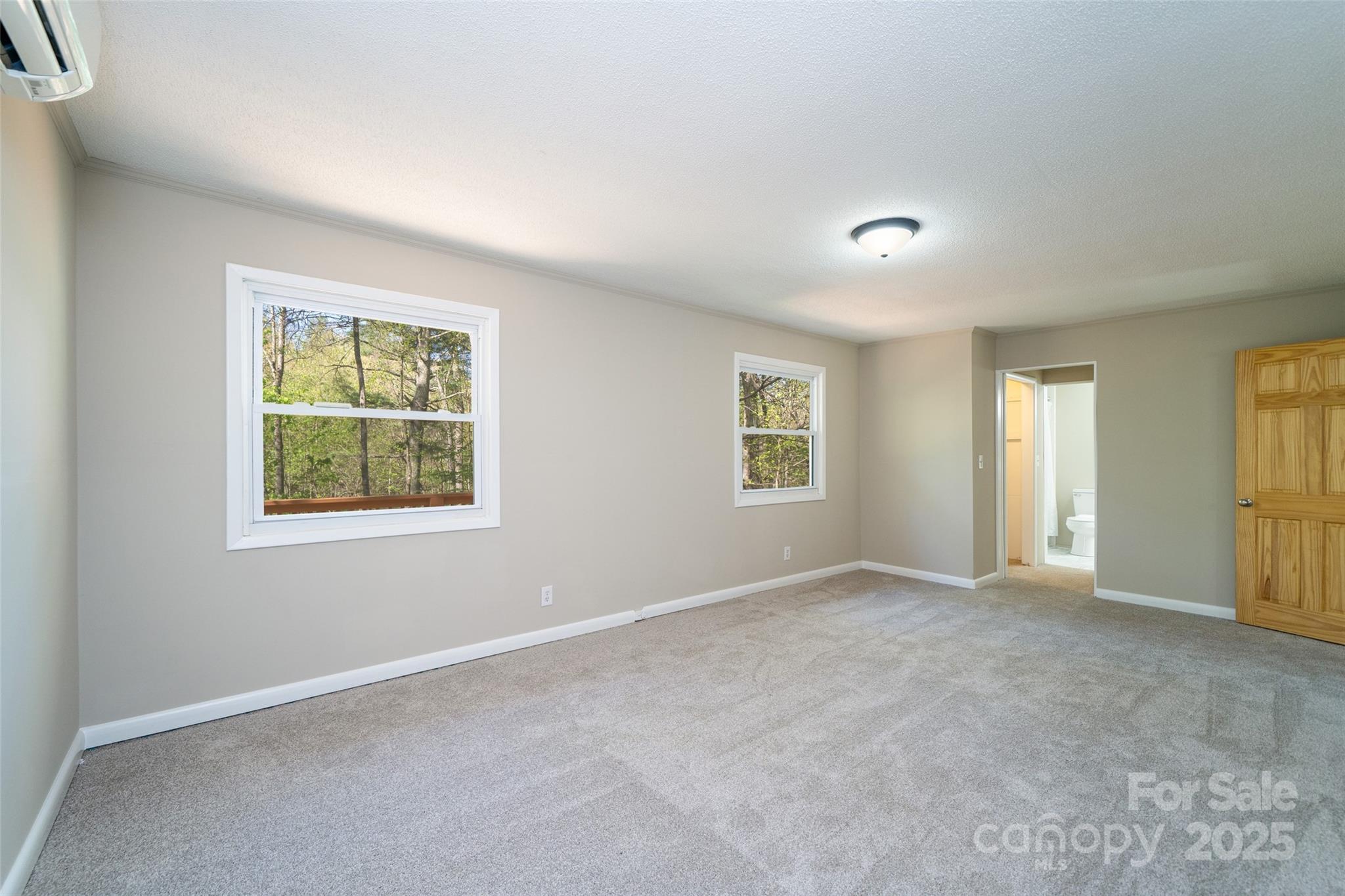 145 Jeter Mountain Road Hendersonville, NC 28739 - Photo 18 of 31 an empty room with windows