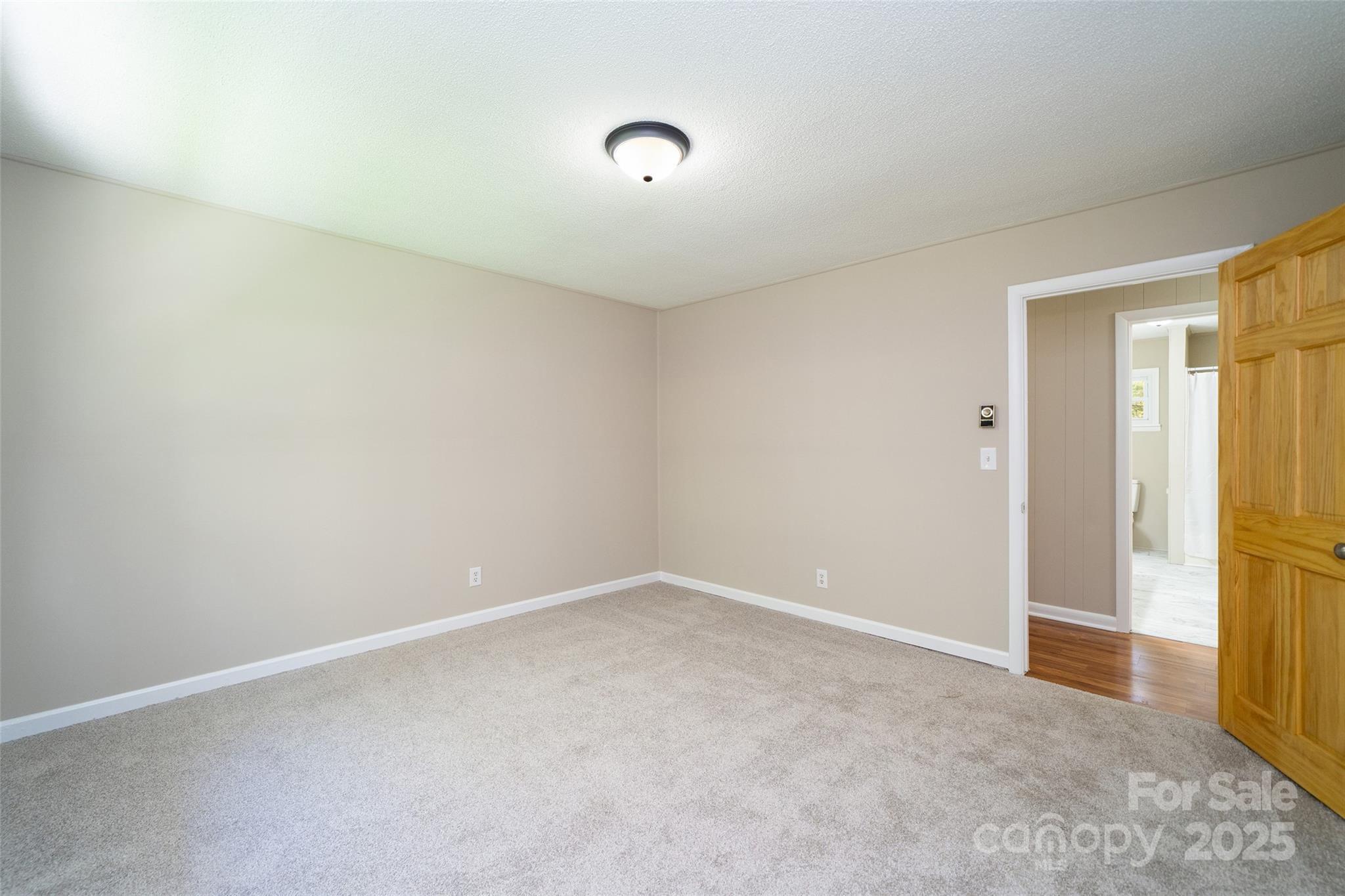 145 Jeter Mountain Road Hendersonville, NC 28739 - Photo 20 of 31 a view of an empty room