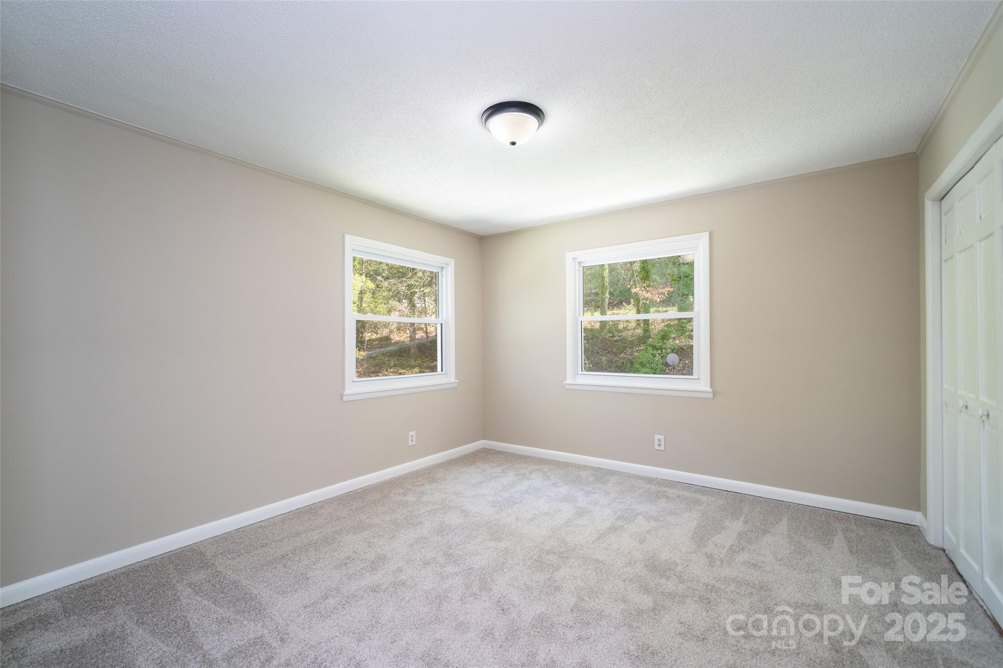 145 Jeter Mountain Road Hendersonville, NC 28739 - Photo 24 of 31 an empty room with windows