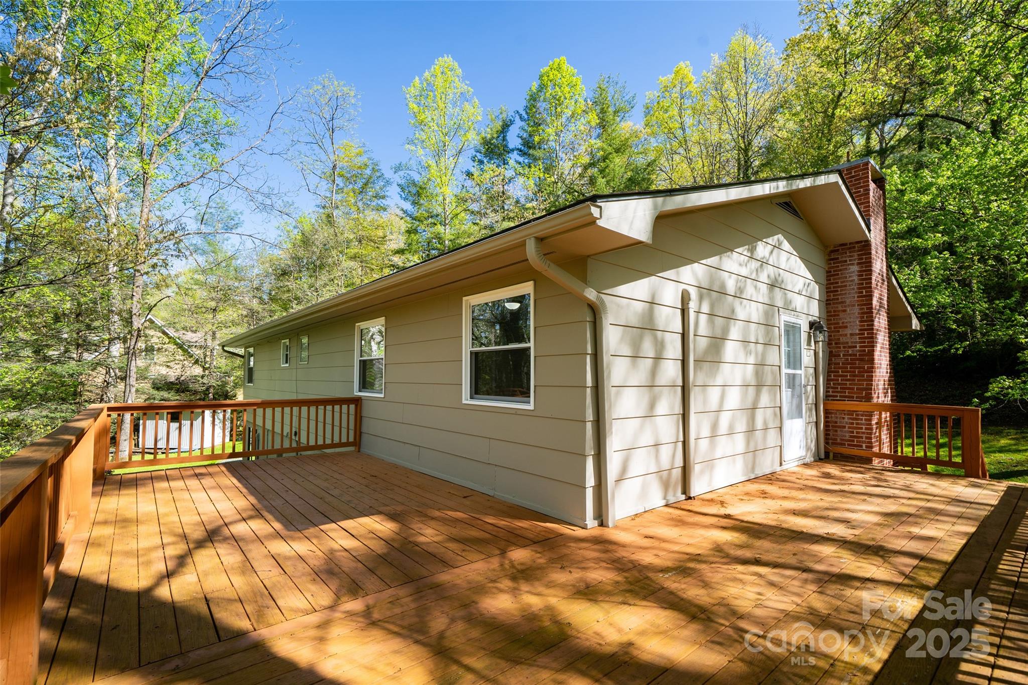 145 Jeter Mountain Road Hendersonville, NC 28739 - Photo 29 of 31 a front view of a house with a garden