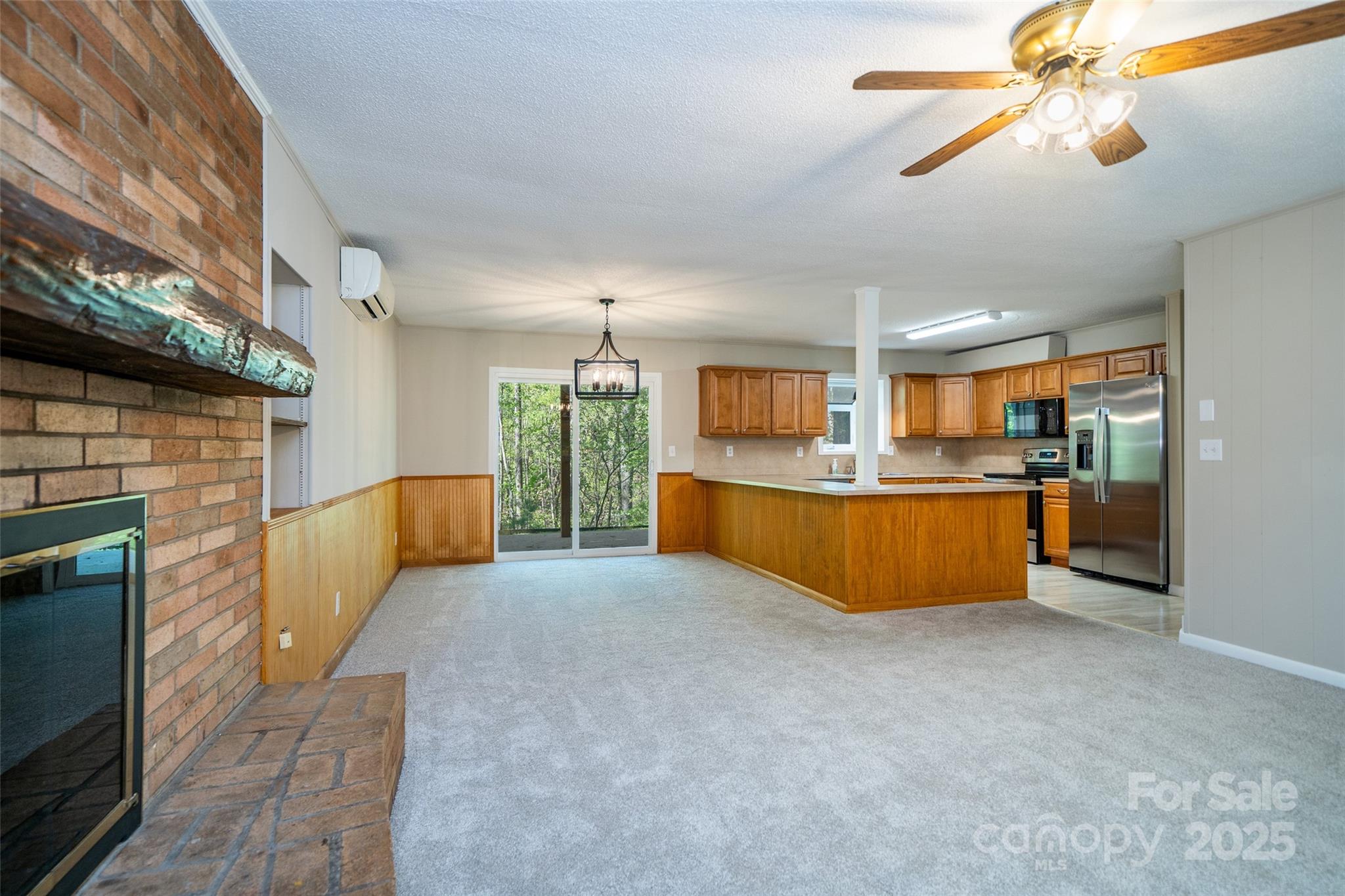 145 Jeter Mountain Road Hendersonville, NC 28739 - Photo 5 of 31 a large kitchen with cabinets a sink and appliances