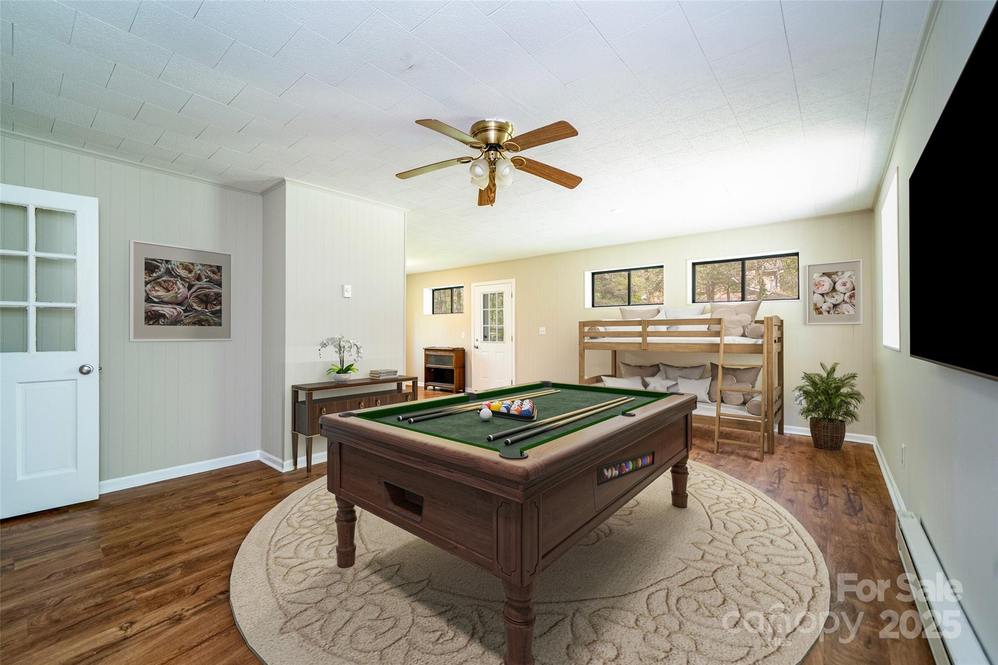 145 Jeter Mountain Road Hendersonville, NC 28739 - Photo 8 of 31 a living room with furniture a flat screen tv and a table
