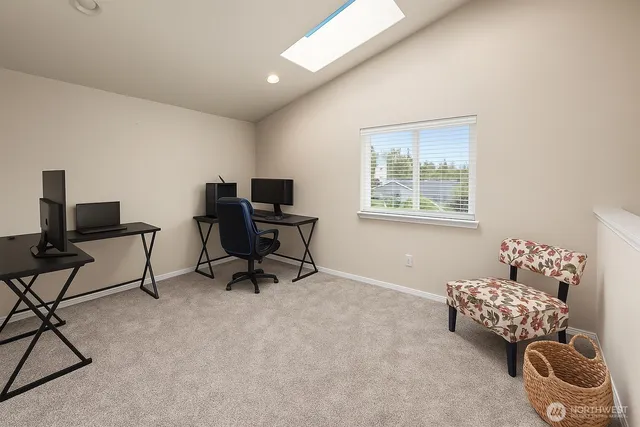 a bedroom with furniture and a window