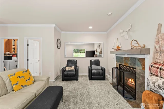 a living room with furniture fireplace and flat screen tv