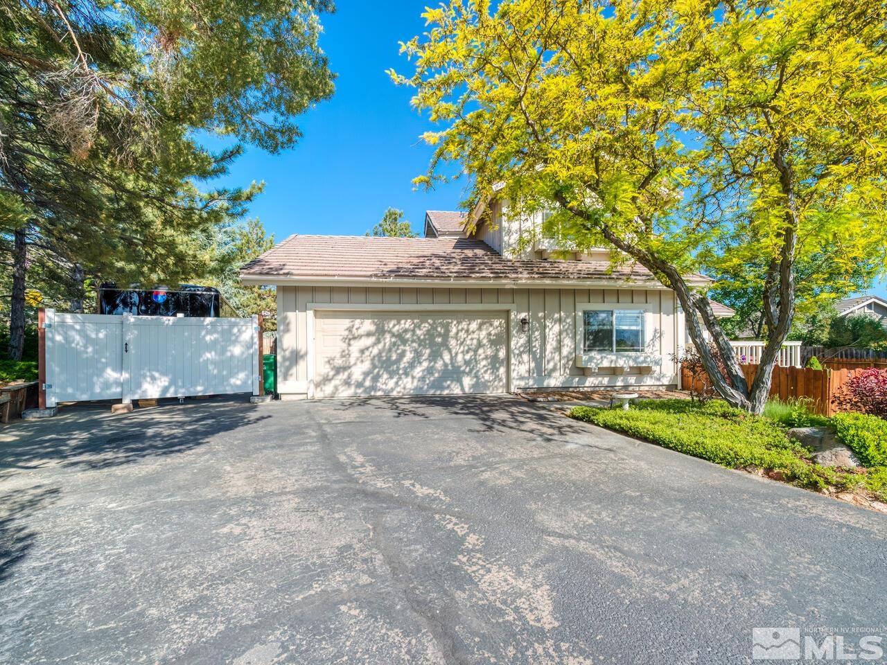 14555 Sundance Drive Reno, NV 89511 - Photo 2 of 40 a view of a house with a yard and tree