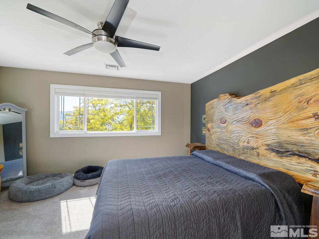 14555 Sundance Drive Reno, NV 89511 - Photo 24 of 40 a bedroom with a bed and a window