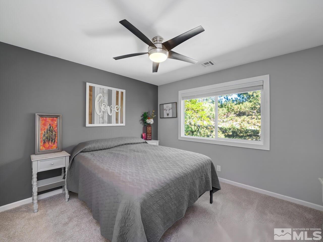 14555 Sundance Drive Reno, NV 89511 - Photo 29 of 40 a bed room with a bed and a window