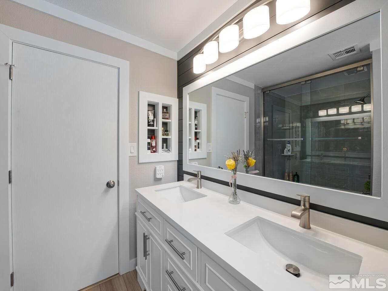 14555 Sundance Drive Reno, NV 89511 - Photo 32 of 40 a bathroom with a sink and a mirror