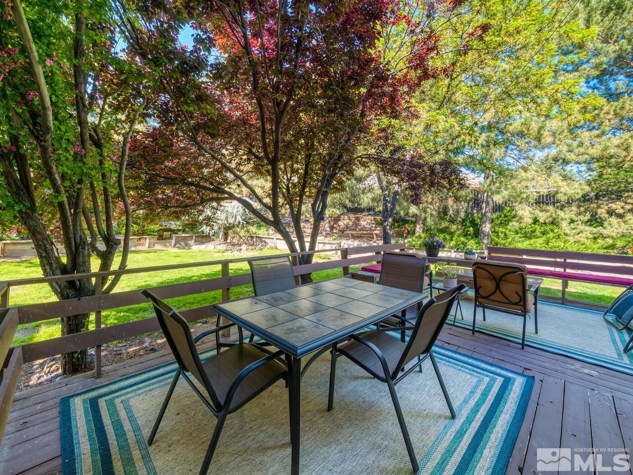 14555 Sundance Drive Reno, NV 89511 - Photo 34 of 40 a backyard of a house with table and chairs