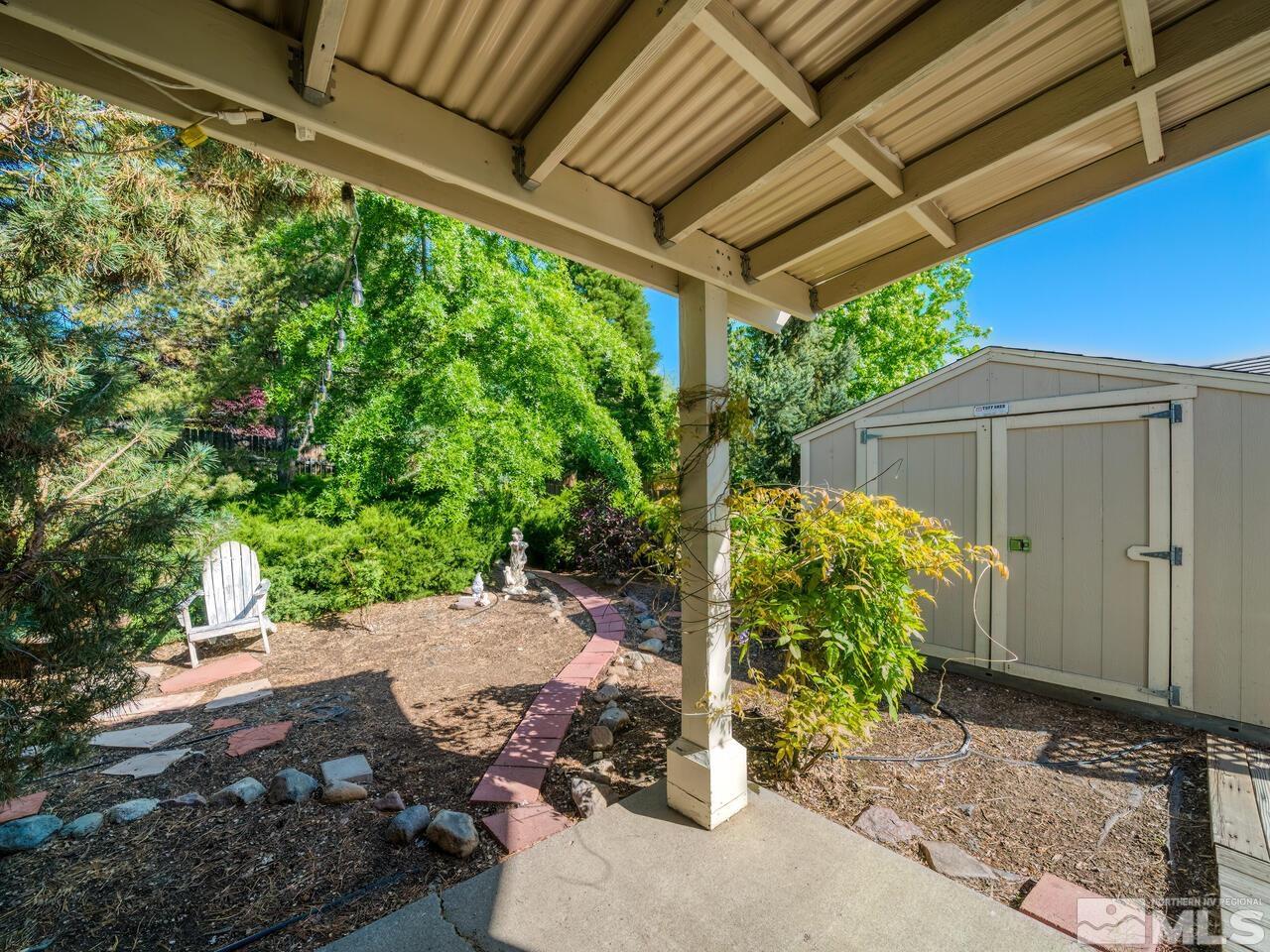 14555 Sundance Drive Reno, NV 89511 - Photo 37 of 40 a backyard of a house with lots of green space