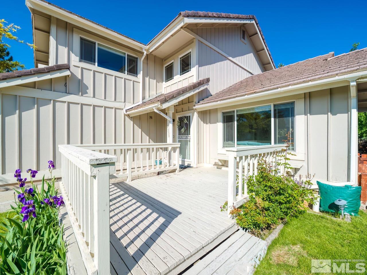 14555 Sundance Drive Reno, NV 89511 - Photo 4 of 40 a front view of a house with a porch