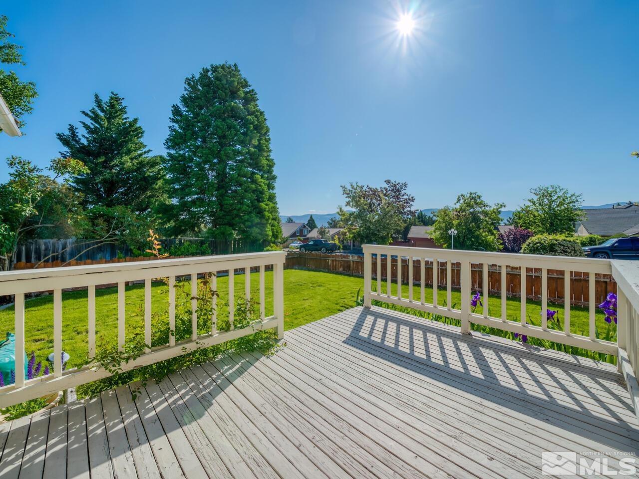 14555 Sundance Drive Reno, NV 89511 - Photo 5 of 40 a view of a wooden deck with a yard