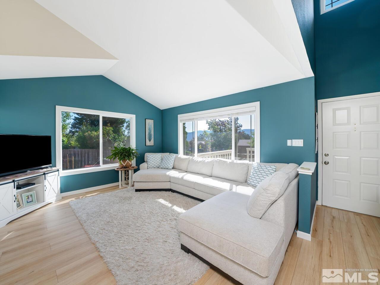 14555 Sundance Drive Reno, NV 89511 - Photo 7 of 40 a living room with furniture and a flat screen tv