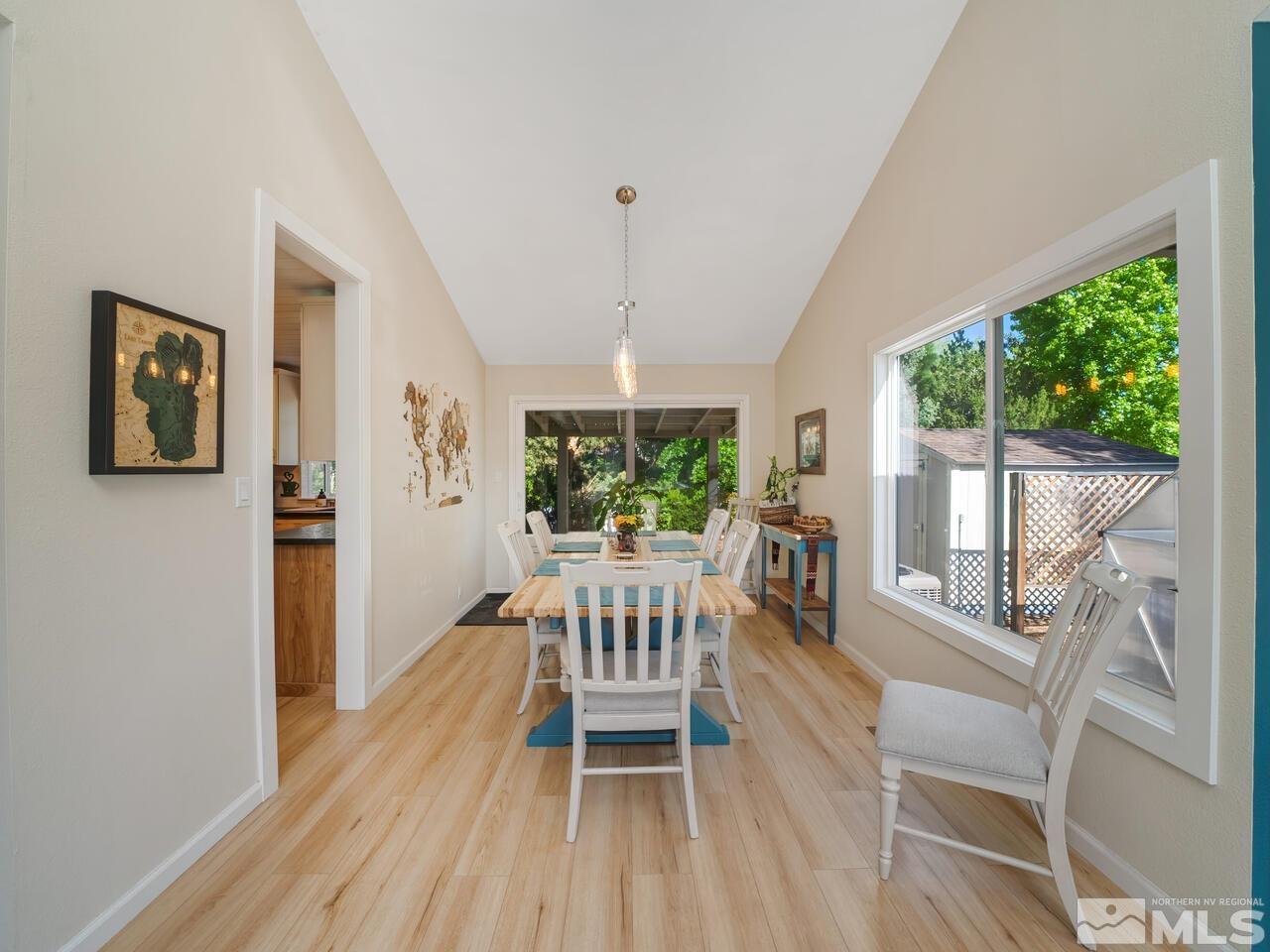 14555 Sundance Drive Reno, NV 89511 - Photo 8 of 40 a view of a dining room with furniture window and wooden floor