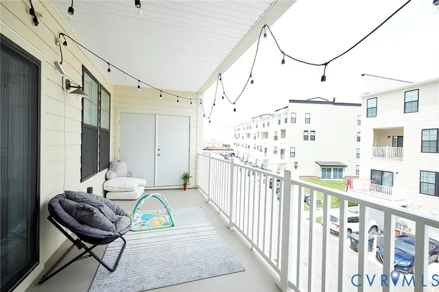a view of a balcony with chairs