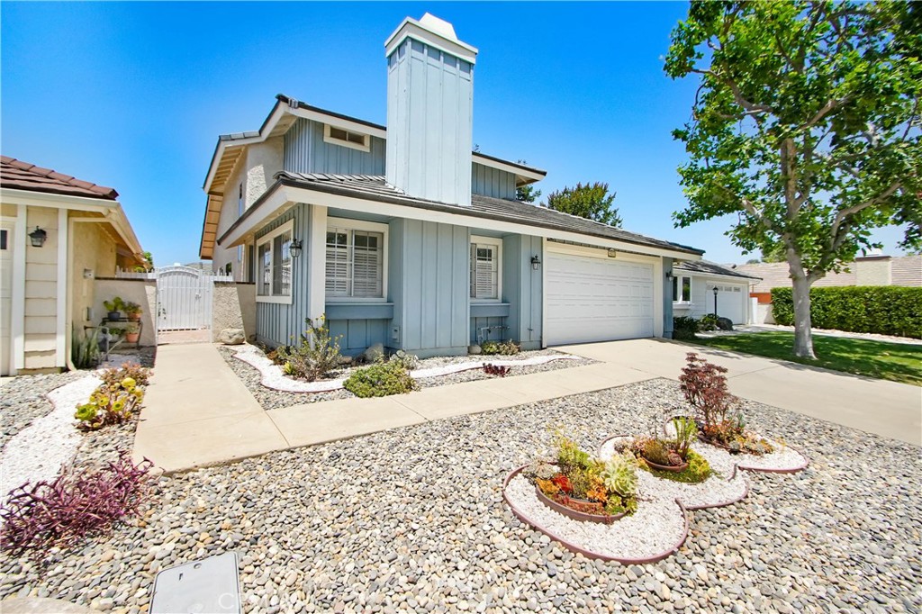 4523 North Millerton Road Moorpark, CA 93021 - Photo 1 of 1 a view of a white house with a swimming pool and sitting area