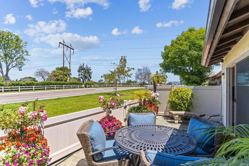 314 Volney Lane Encinitas, CA 92024 - Photo 14 of 28 a view of a chairs and table in patio with a lake view