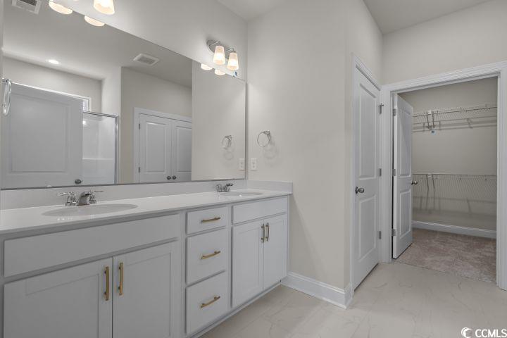 112 Furnies Place Conway, SC 29526 - Photo 13 of 24 Bathroom with double vanity and a walk in closet