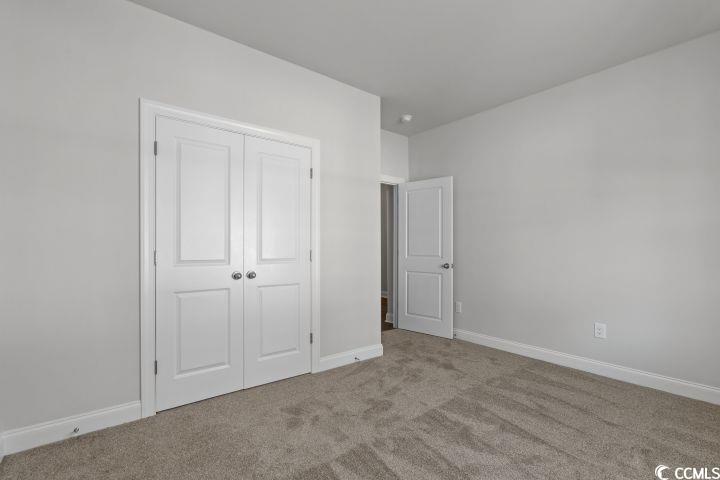 112 Furnies Place Conway, SC 29526 - Photo 19 of 24 Unfurnished bedroom with carpet flooring and a closet