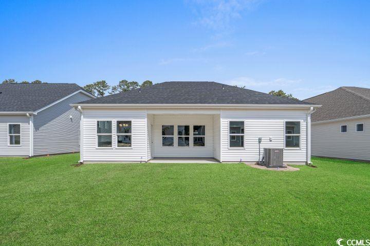 112 Furnies Place Conway, SC 29526 - Photo 22 of 24 Rear view of house featuring a patio and a yard