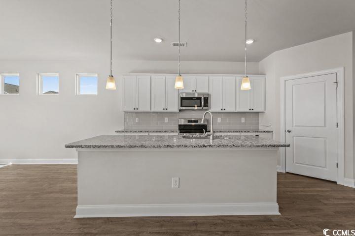 112 Furnies Place Conway, SC 29526 - Photo 9 of 24 Kitchen with backsplash, white cabinetry, pendant lighting, and dark wood-style floors