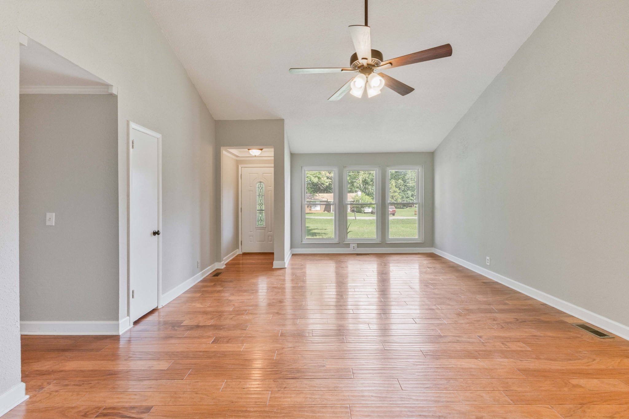2306 Raspberry Lane Lebanon, TN 37087 - Photo 19 of 100 an empty room with wooden floor fan and windows