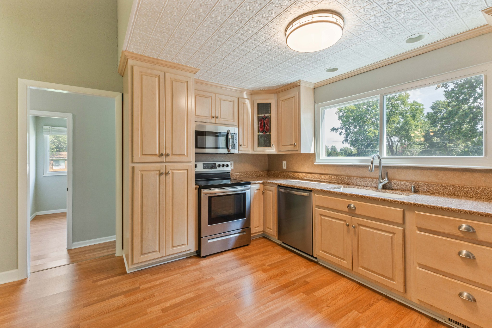 2306 Raspberry Lane Lebanon, TN 37087 - Photo 24 of 100 a kitchen with kitchen island granite countertop a stove sink and microwave