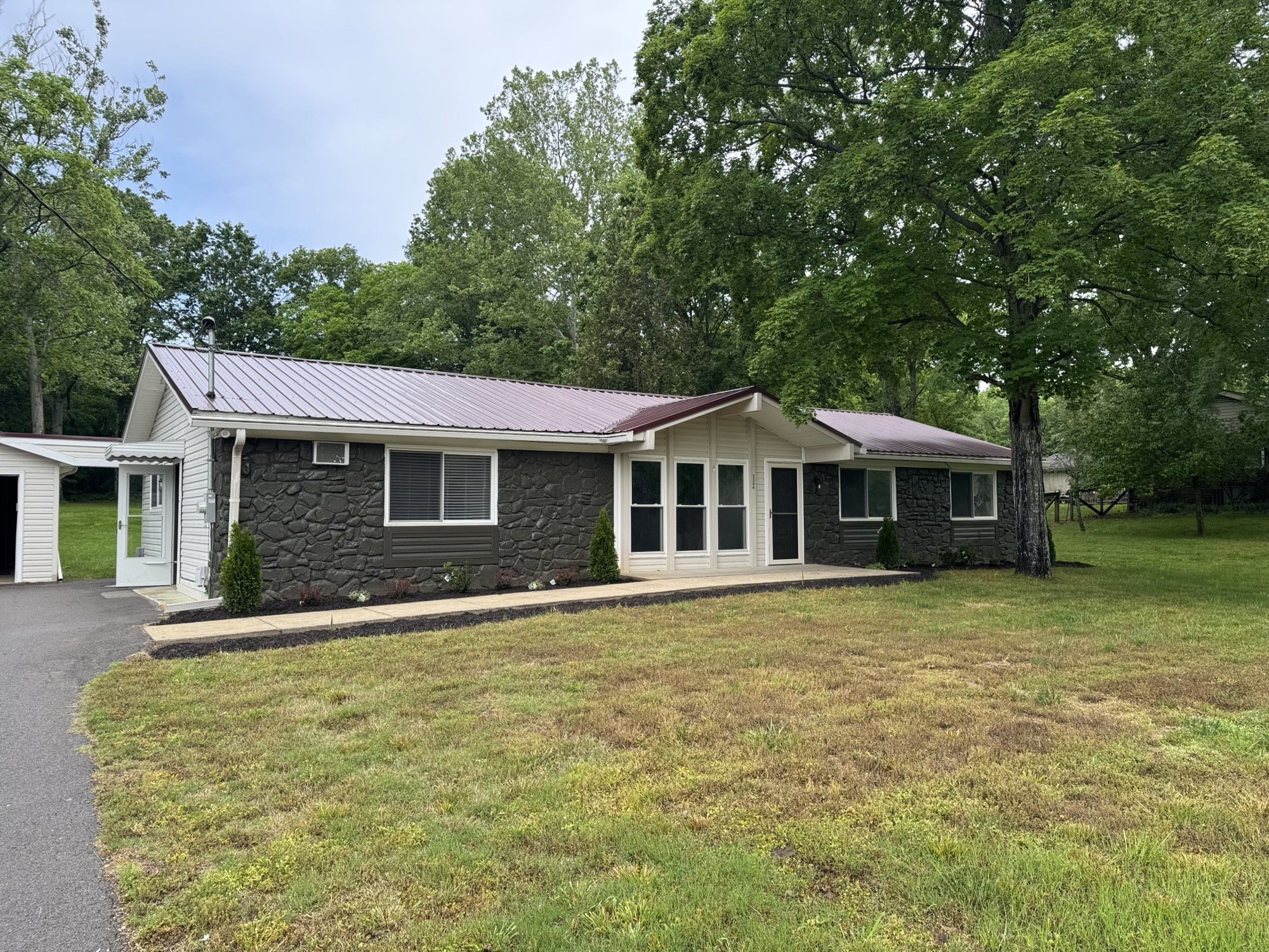 2306 Raspberry Lane Lebanon, TN 37087 - Photo 43 of 100 a front view of a house with a garden