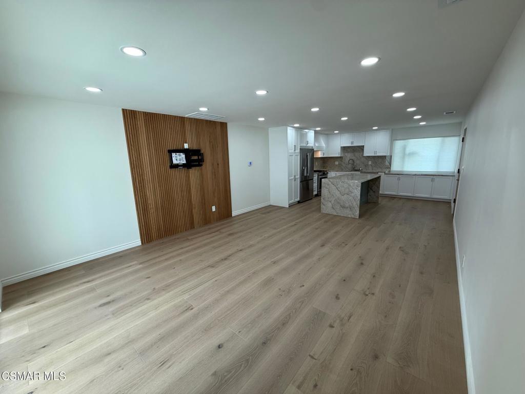 102 West Alta Green Port Hueneme, CA 93041 - Photo 5 of 23 an empty room with wooden floor and windows