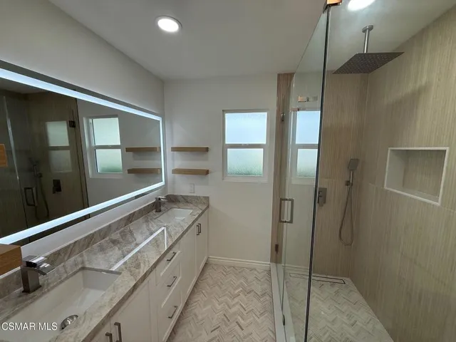 a kitchen with a refrigerator and cabinets