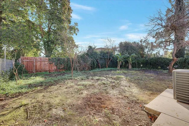 a view of backyard with green space