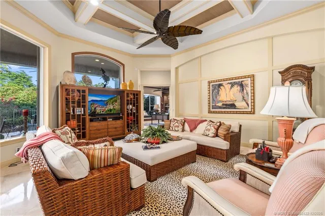 a bedroom with a bed and a potted plant on the dresser