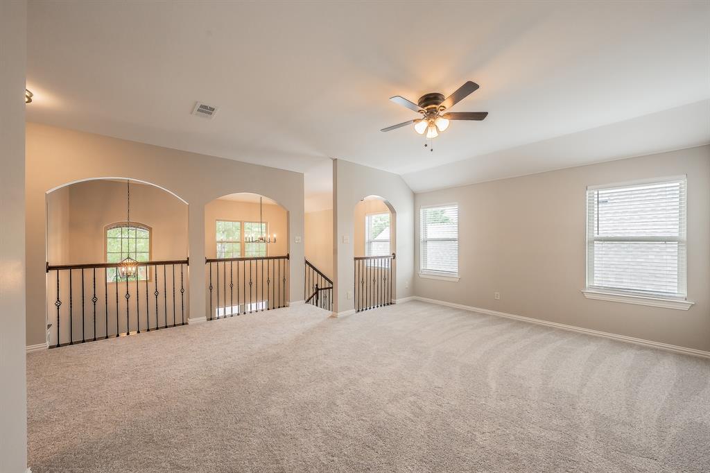 412 Hideaway Road McKinney, TX 75072 - Photo 30 of 40 a view of a livingroom with a ceiling fan and window