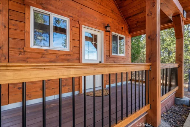 a view of a brick house with large windows