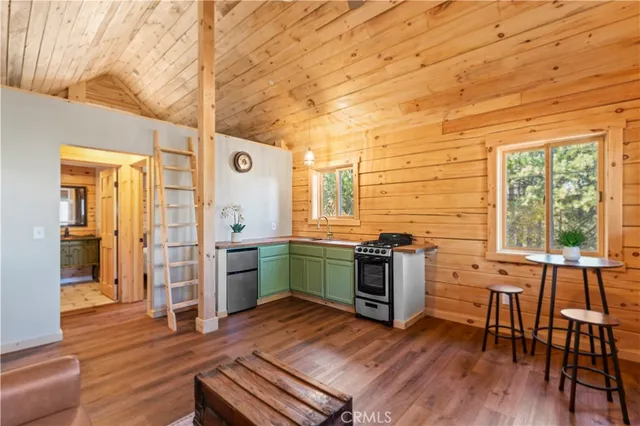 a kitchen with a table chairs and a stove
