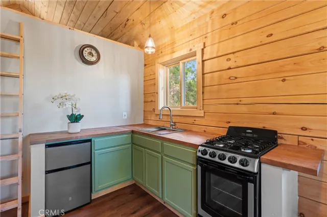 a kitchen with a stove and cabinets