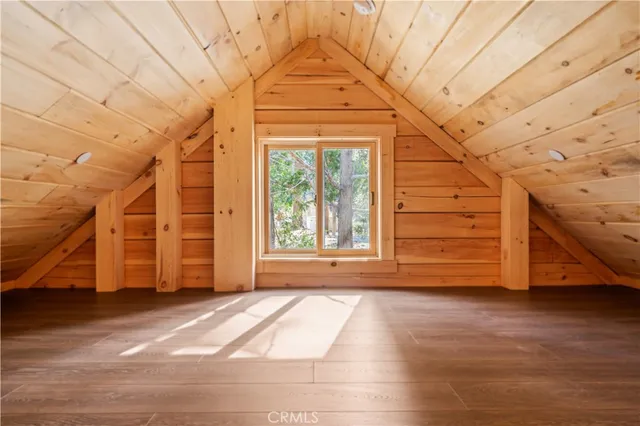 a view of a livingroom with an empty space and wooden floor