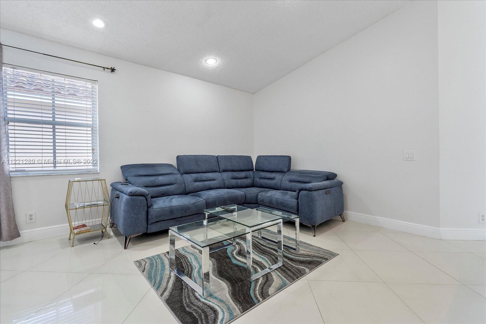 7384 Granada Way Margate, FL 33063 - Photo 14 of 30 a living room with furniture and a window