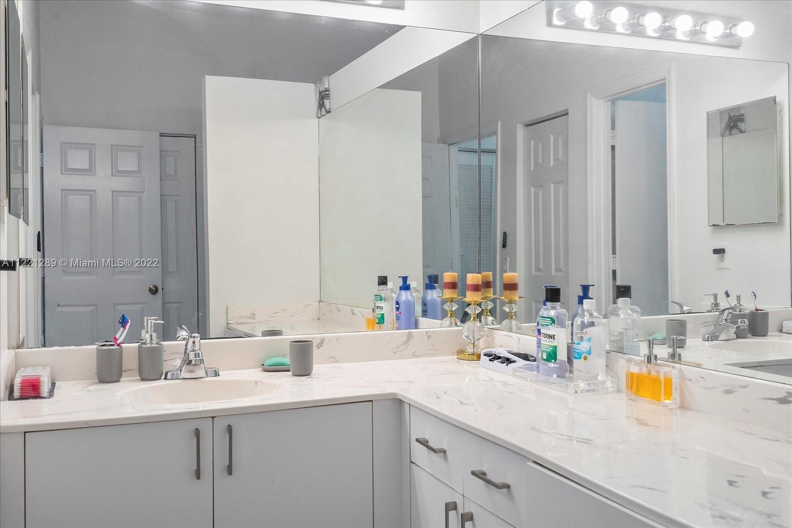 7384 Granada Way Margate, FL 33063 - Photo 16 of 30 a bathroom with a sink and a mirror