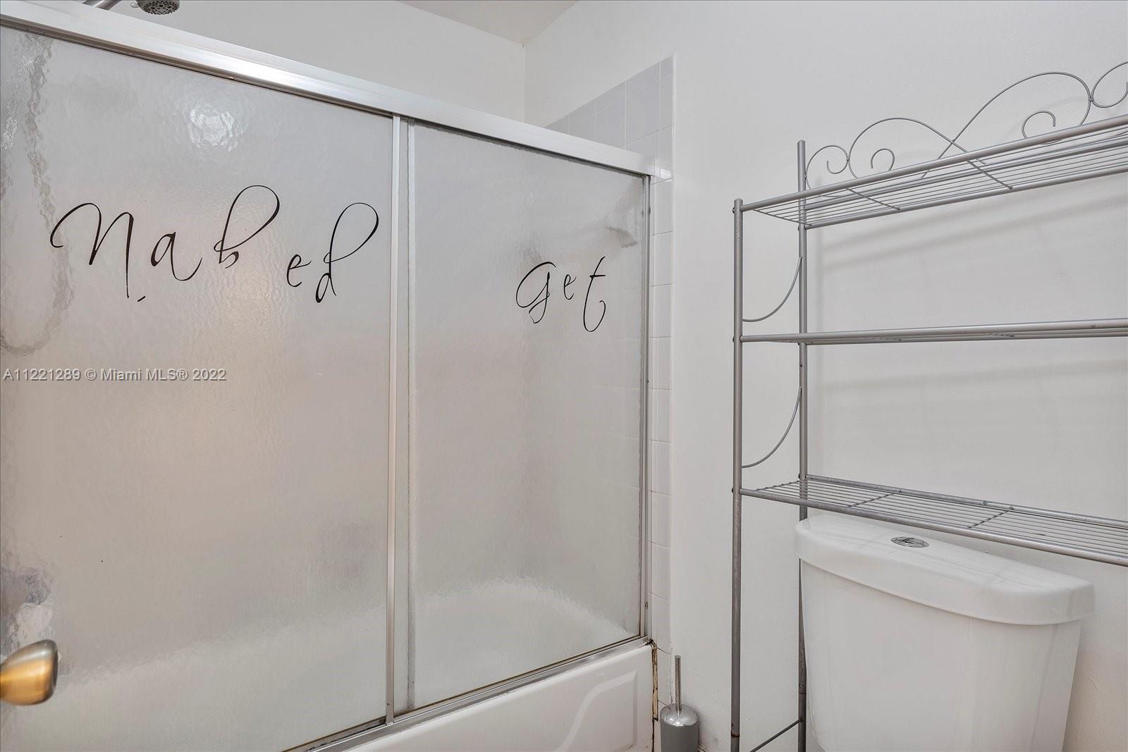 7384 Granada Way Margate, FL 33063 - Photo 17 of 30 a bathroom with a shower and a sink