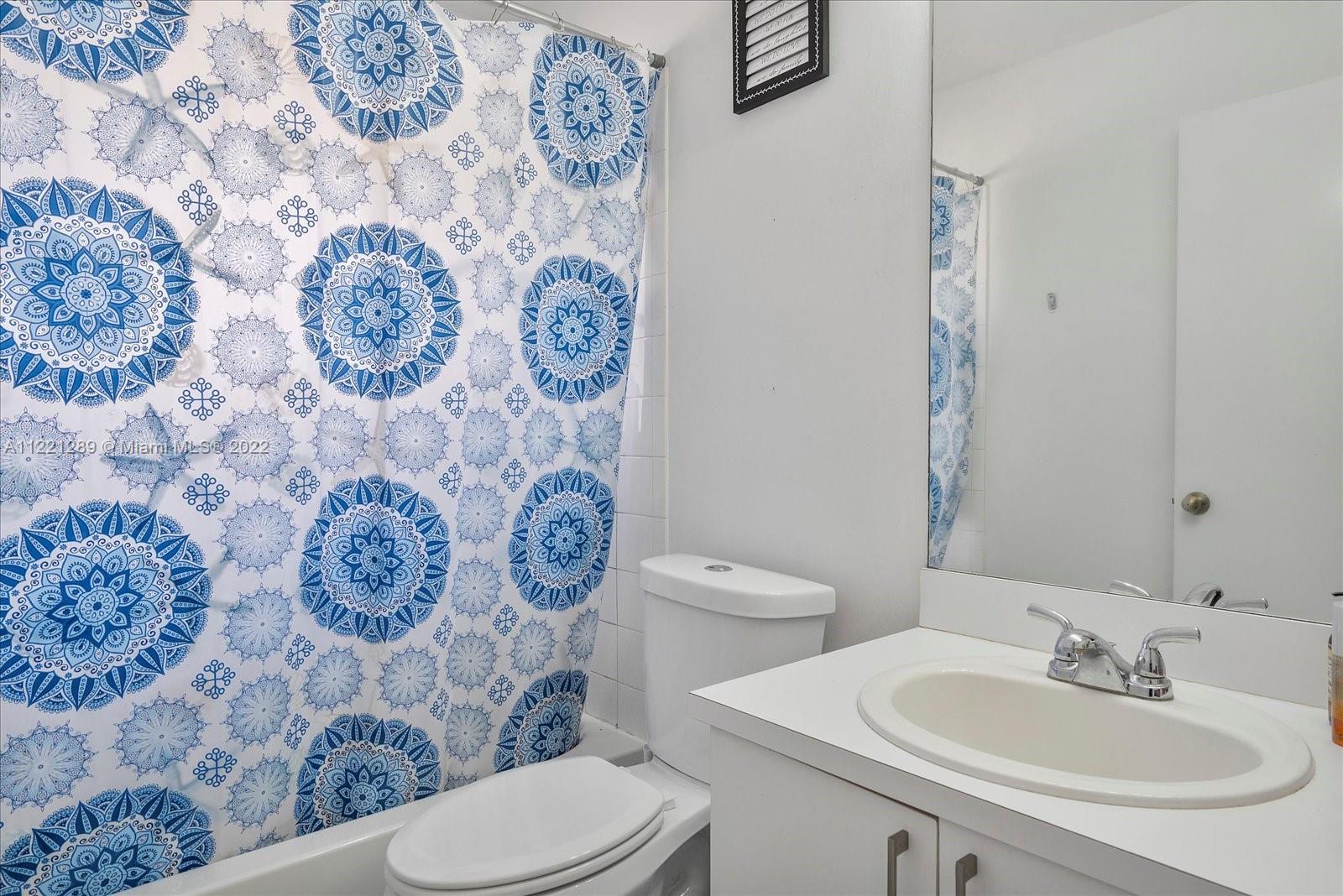 7384 Granada Way Margate, FL 33063 - Photo 21 of 30 a bathroom with a toilet and a sink